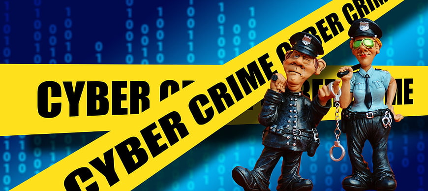 Cyber Crime Concept with Police Figurines and Binary Code