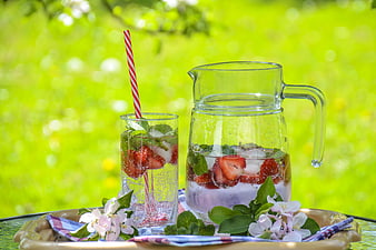 Refreshing Strawberry Mint Lemonade Pitcher and Glass Outdoors