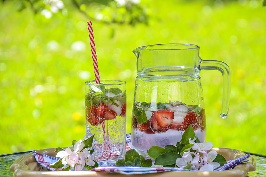 Refreshing Strawberry Mint Lemonade Pitcher and Glass Outdoors