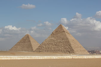 Giza Pyramids in Egypt with Blue Sky and Clouds