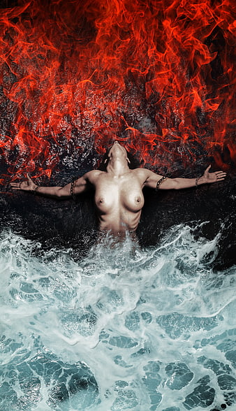 Nude woman lying in water with fire background