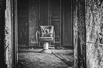Abandoned Interrogation Chair in Dark Decaying Room