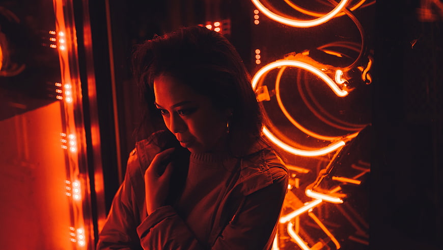 Woman in Neon Red Light Cyberpunk Atmosphere