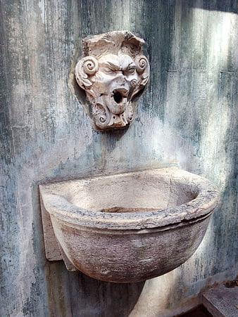 Ancient Stone Fountain with Lion Head Sculpture in Lisbon