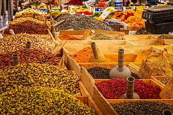 Colorful Spices and Nuts at a Traditional Market Stall