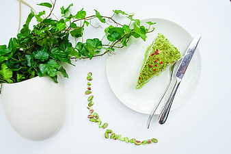 Overhead View of Pistachio Cake Slice with Greenery