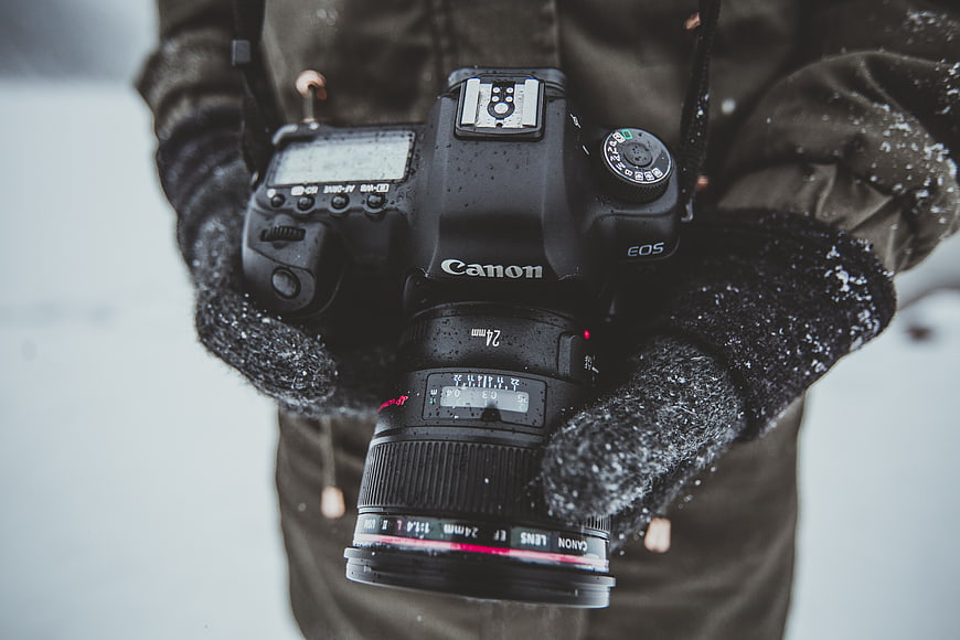 Close-up of Canon DSLR Camera in Snowy Winter