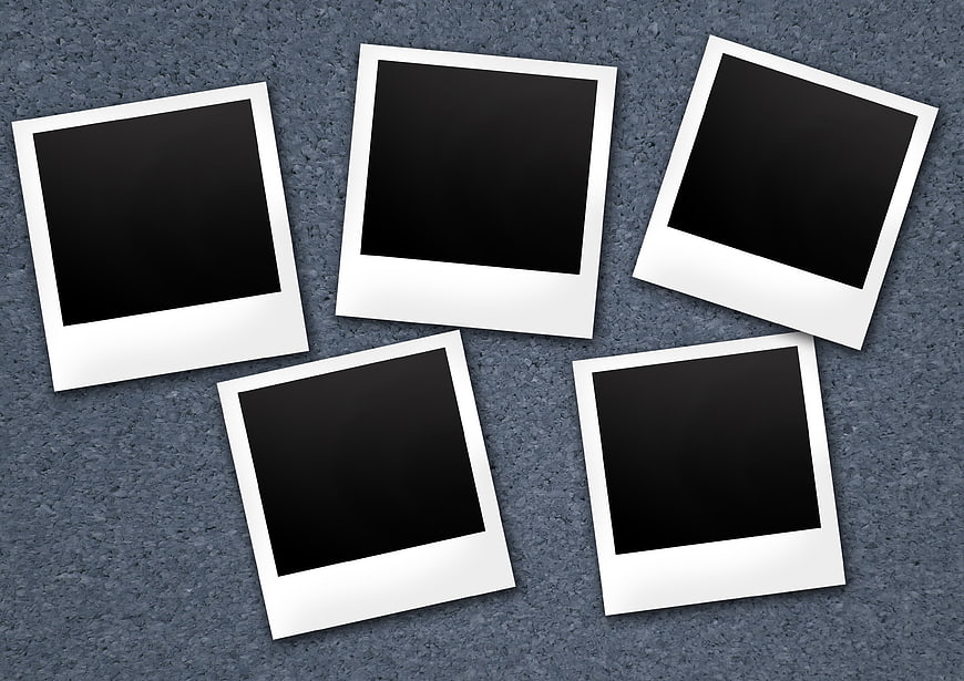 Blank Polaroid Photos on Textured Blue Background