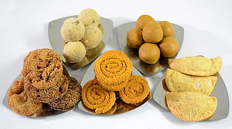 Traditional Indian Diwali Sweets And Savory Snacks On Metal Plates