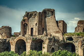 Ancient Roman Ruins with Arches and Blue Sky
