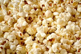 Close-up texture of fluffy white popcorn kernels