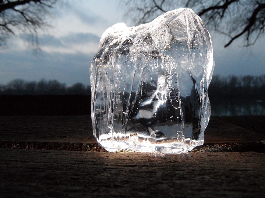 Clear ice block sculpture with frozen figure inside
