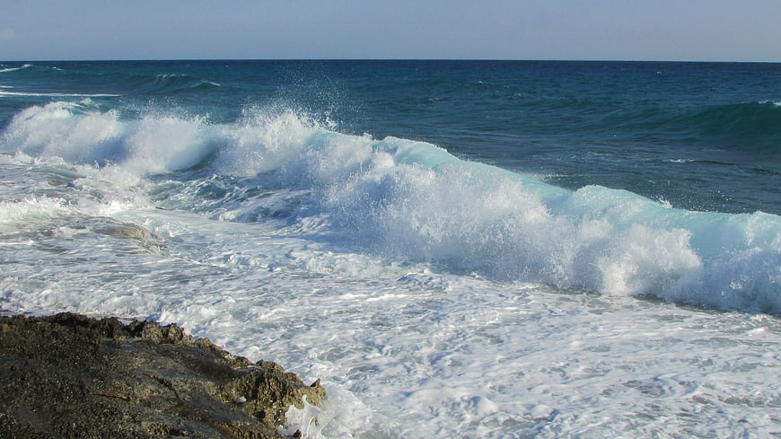 Powerful Ocean Wave Crashing on Rocky Shore