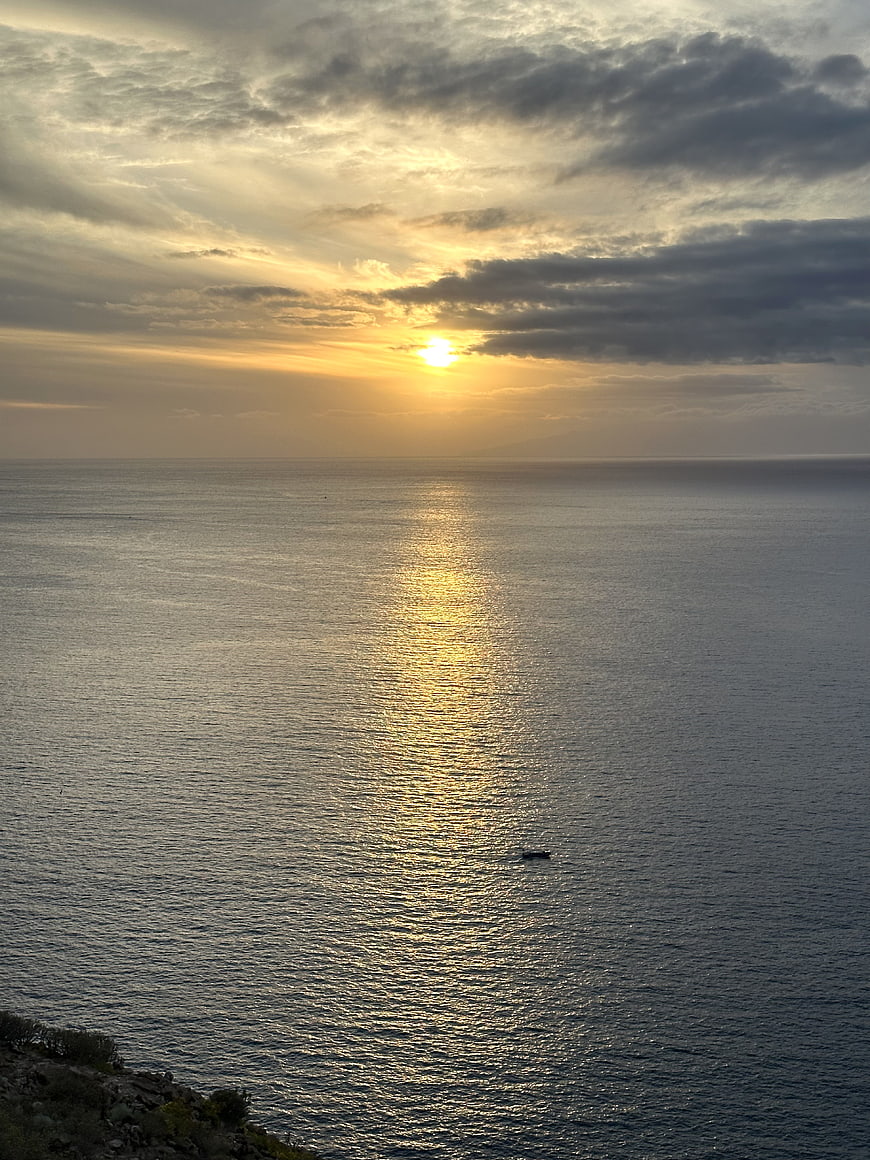 Serene Ocean Sunset with Golden Sunlight Reflection on Water