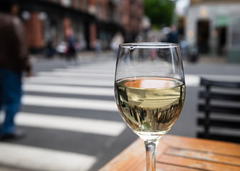 Glass of White Wine on Outdoor Cafe Table