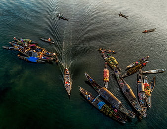 Aerial view of floating market boats on a river in Vietnam