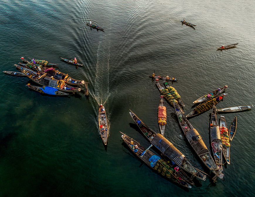 Aerial view of floating market boats on a river in Vietnam