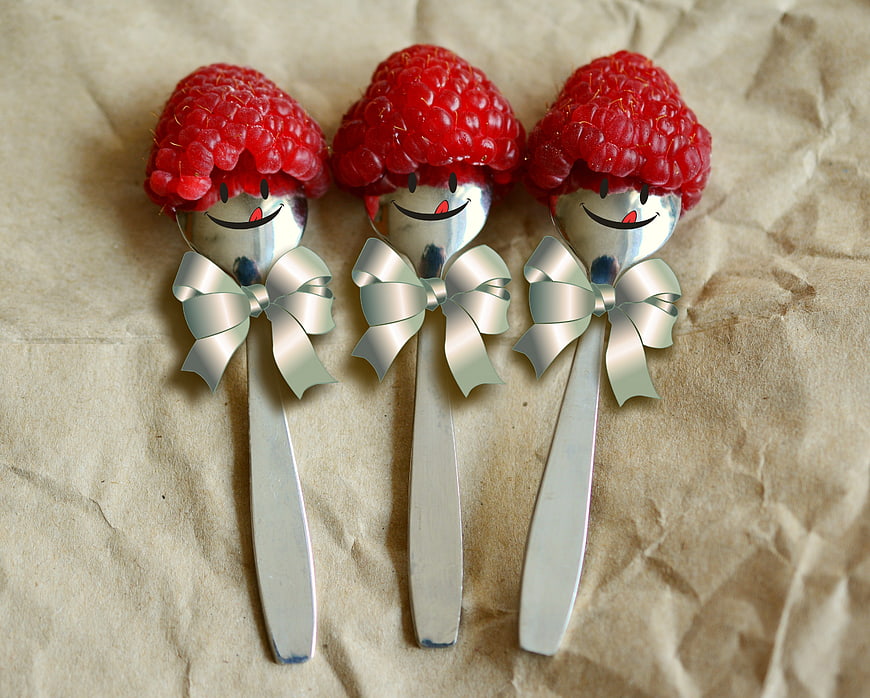 Three Smiling Raspberry Spoon Characters With Silver Ribbons
