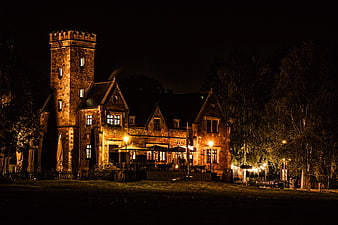 Historic Stone Castle Restaurant Illuminated at Night