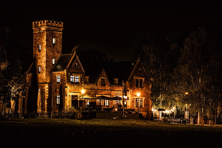 Historic Stone Castle Restaurant Illuminated at Night
