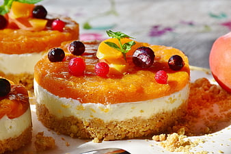 Mini Apricot Quark Tarts with Fresh Berries and Mint Garnish