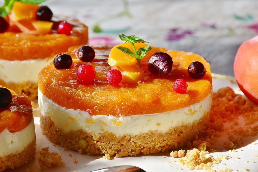 Mini Apricot Quark Tarts with Fresh Berries and Mint Garnish