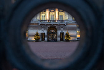 Buckingham Palace Entrance Framed Through Circular Opening
