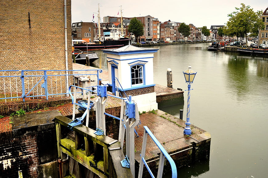 Blue and white lock gate mechanism on a canal in the Netherlands