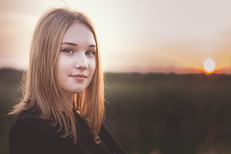 Portrait of Young Woman with Blonde Hair at Sunset