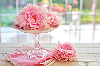 Pink Peonies on Glass Pedestal with Pink Napkin on Wooden Table