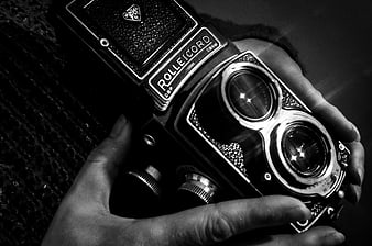 Vintage Rolleicord Camera Held in Hands