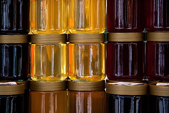 Backlit Honey Jars Displayed in a Colorful Grid