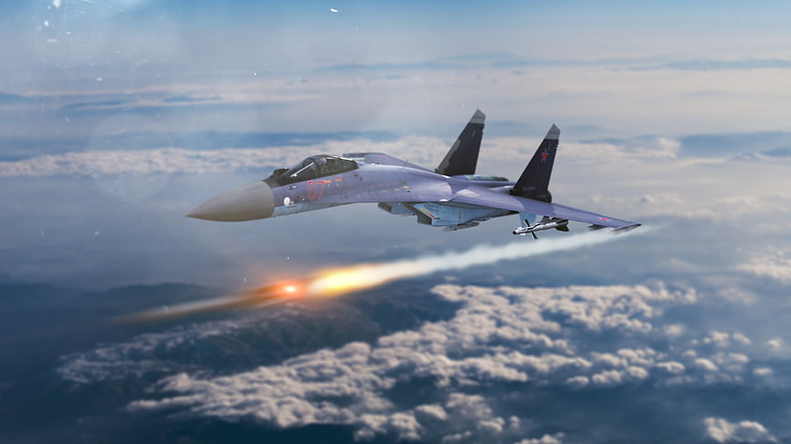Sukhoi Su-35 fighter jet firing missile over clouds