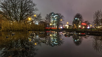 Winter Night Cityscape Reflection in Frozen Pond