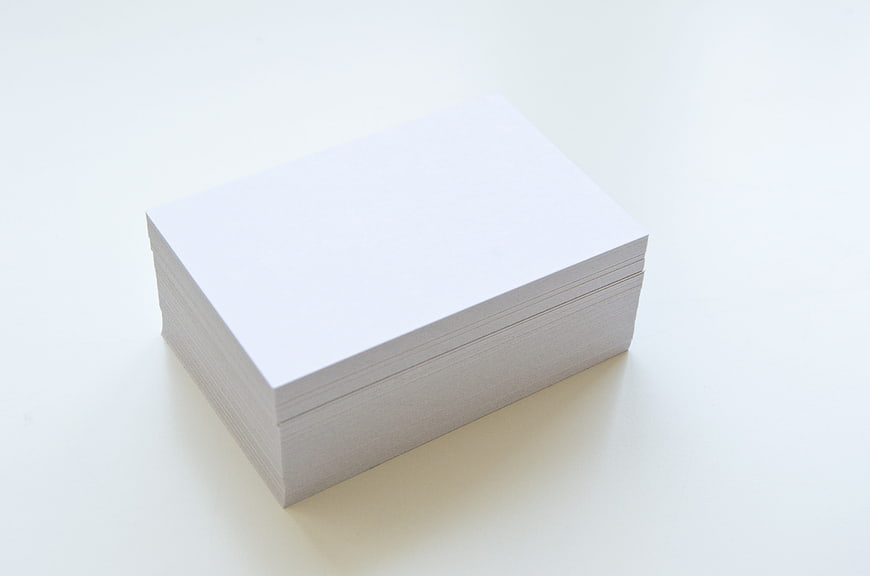 Stack of Blank White Business Cards on White Background