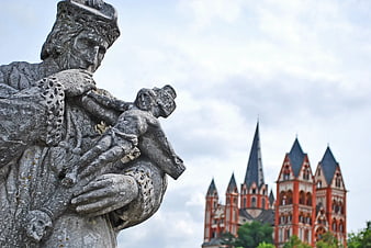 Stone Statue of Saint Christopher with Speyer Cathedral Background