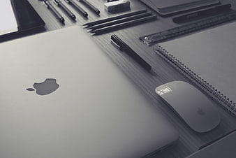Grayscale Workspace with Laptop, Mouse, and Stationery