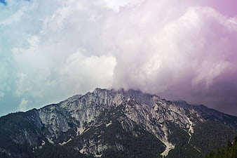 Dramatic mountain landscape with purple storm clouds