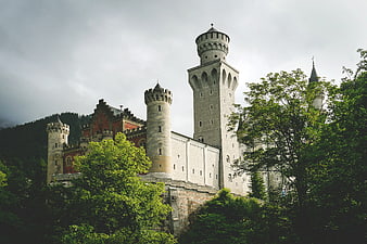 Neuschwanstein Castle Towers Amidst Lush Green Forest