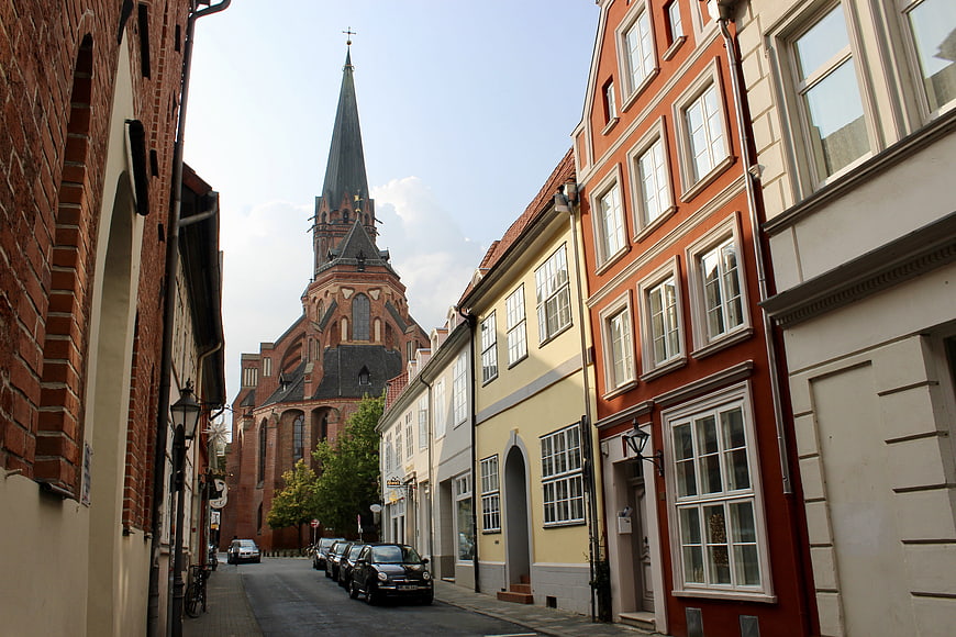Colorful European Street with Historic Brick Church Spire