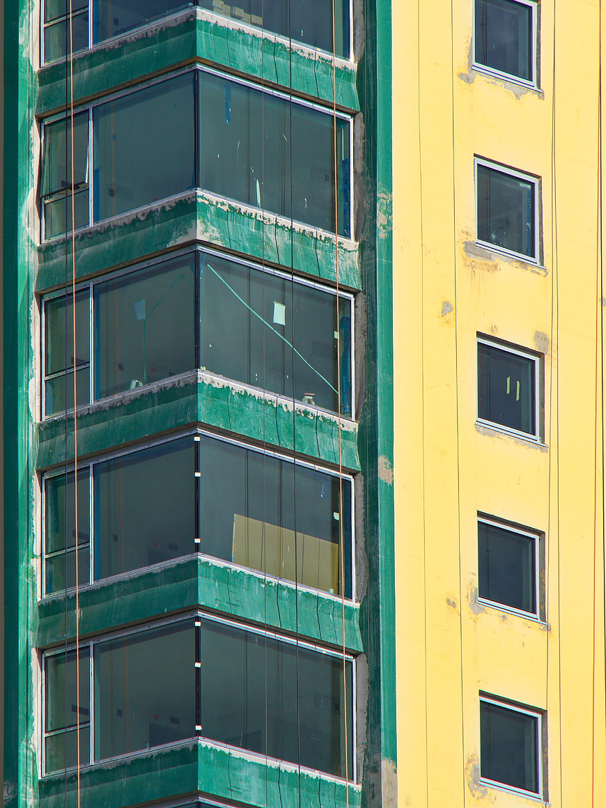 Colorful modern building facade with green and yellow walls
