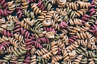 Top view of colorful tricolor fusilli pasta