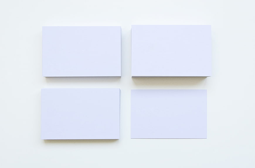 Blank white business card mockup on clean background