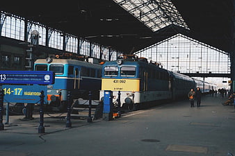 Vintage Blue and Yellow Trains at Historic Railway Station Platform