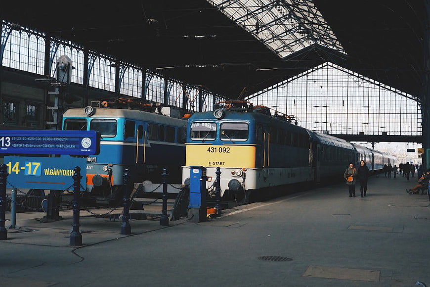 Vintage Blue and Yellow Trains at Historic Railway Station Platform