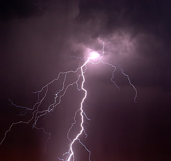 Dramatic Night Lightning Strike Illuminating Dark Storm Clouds