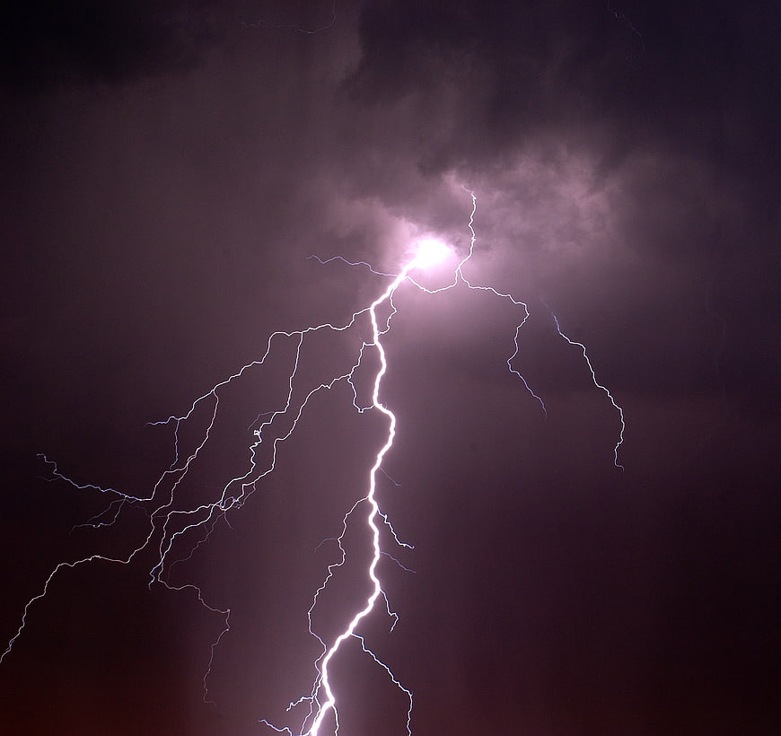 Dramatic Night Lightning Strike Illuminating Dark Storm Clouds
