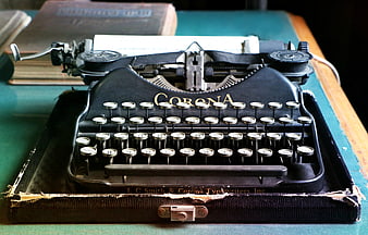 Vintage Corona Typewriter In Worn Leather Case On Green Desk