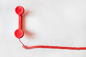 Red Telephone Handset on White Background