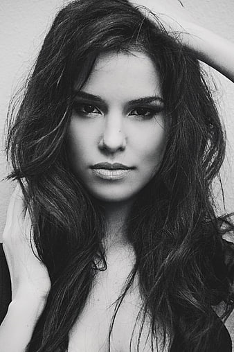 Black and white portrait of a young woman with long dark hair